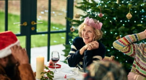 People laughing over Christmas dinner